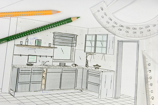 Skizze einer Küche mit Stift und Lineal